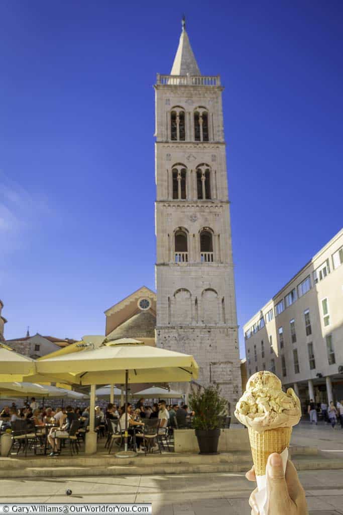 Holding a freshly scooped gelato in the shadow of the Venetian Bell Tower in the old town of Zadar.