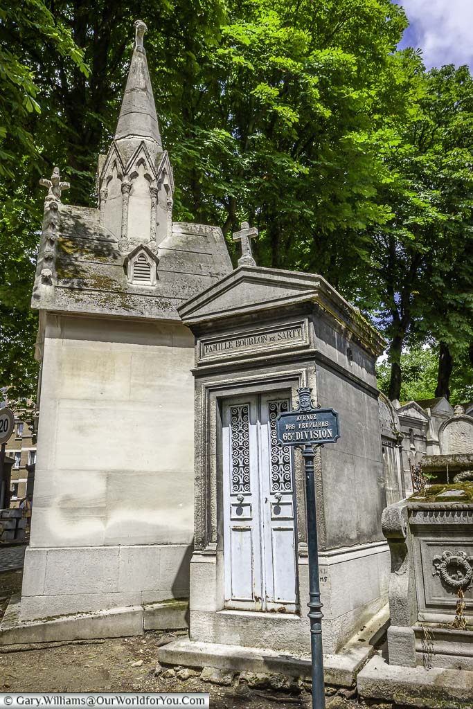A pair of tombs on the Avenue Des Peupliers within the Père Lachaise Cemetery in Paris, France