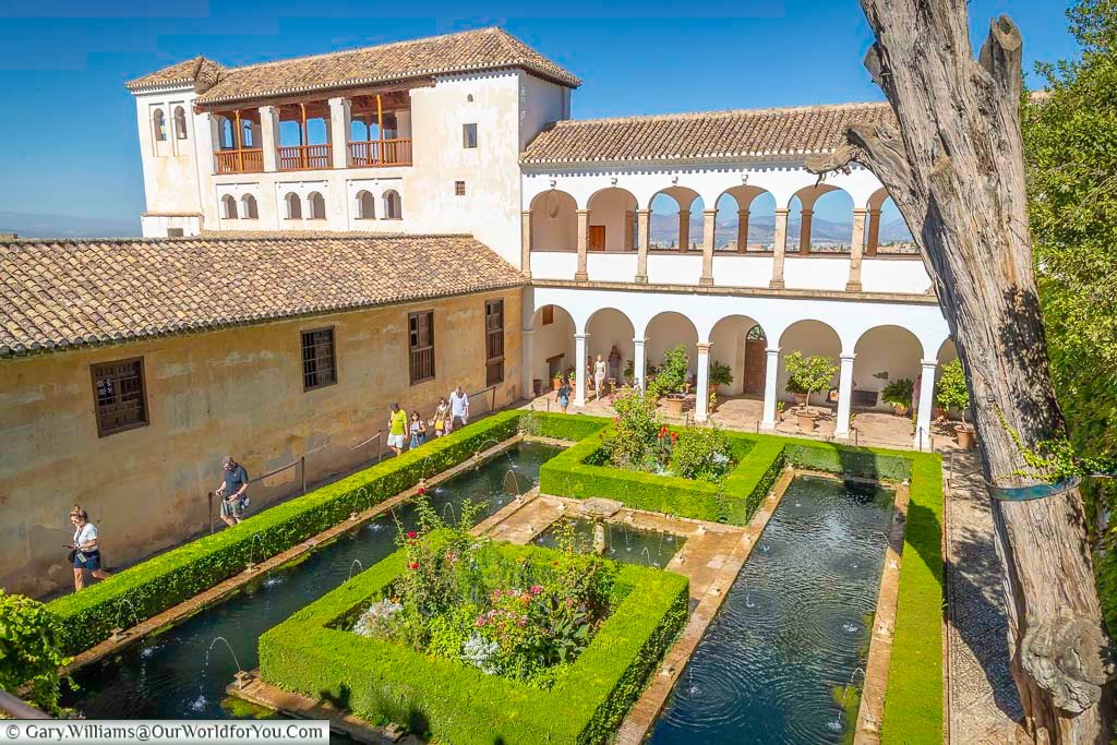 Looking down on a patio within the generalife gardens of the alhambra palace in granada, southern spain