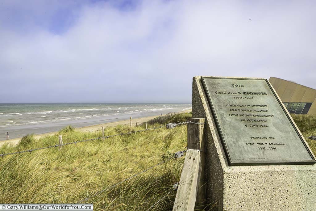 a memorial plaque at a lookout point over utah beach in normandy, france