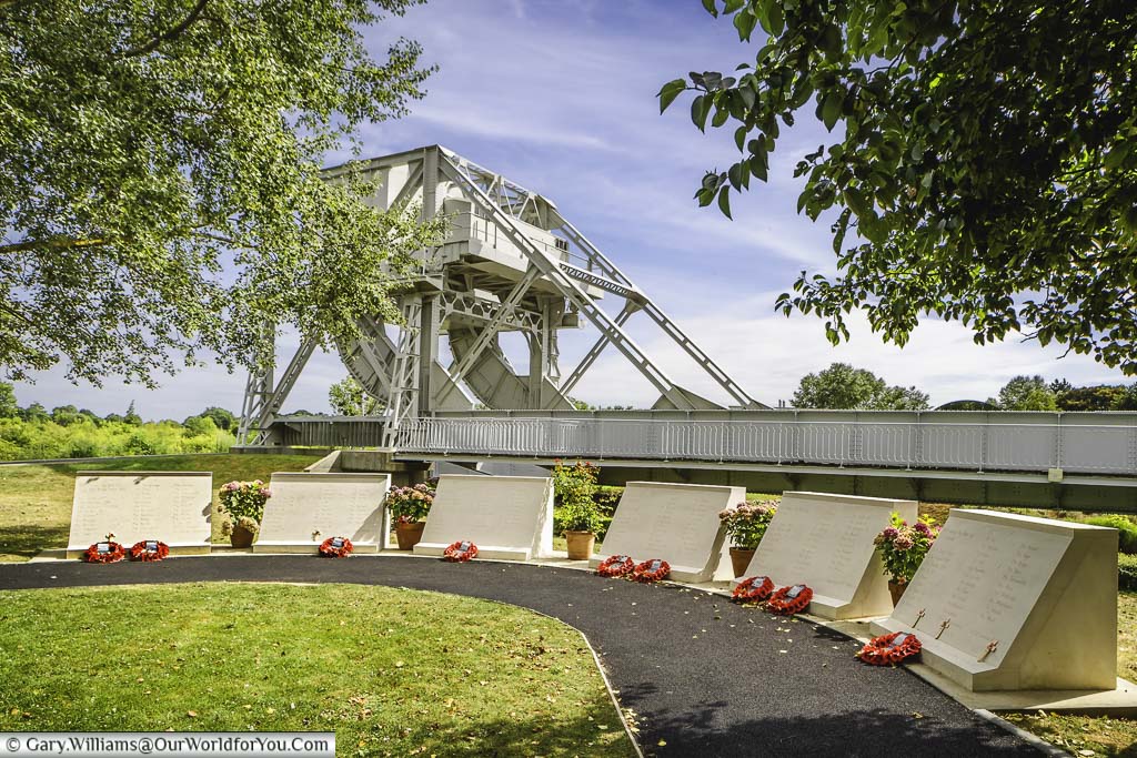 A line of memorial plinths in front of the Pegasus Bridge in Normandy, France