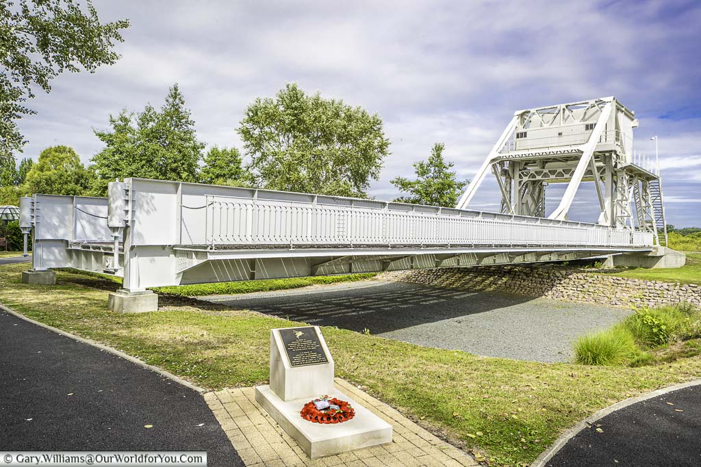 A stone monument in front of the now relocated Pegasus Bridge in Normandy.