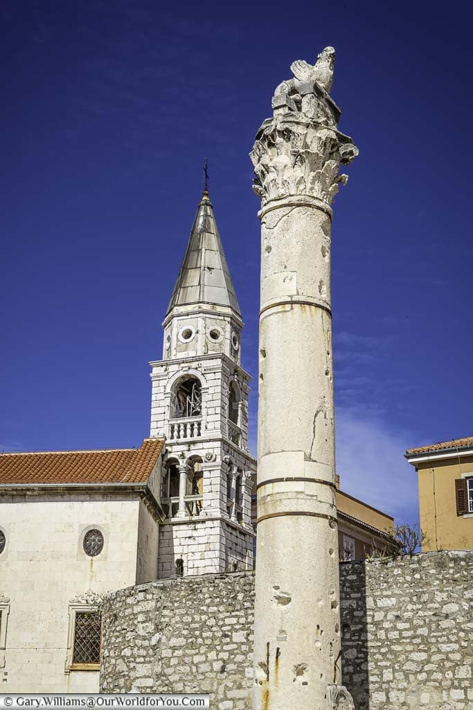 The Roman ‘Pillar of Shame’ in the Roman Forum of Zadar, with the Venetian Bell Tower in the background