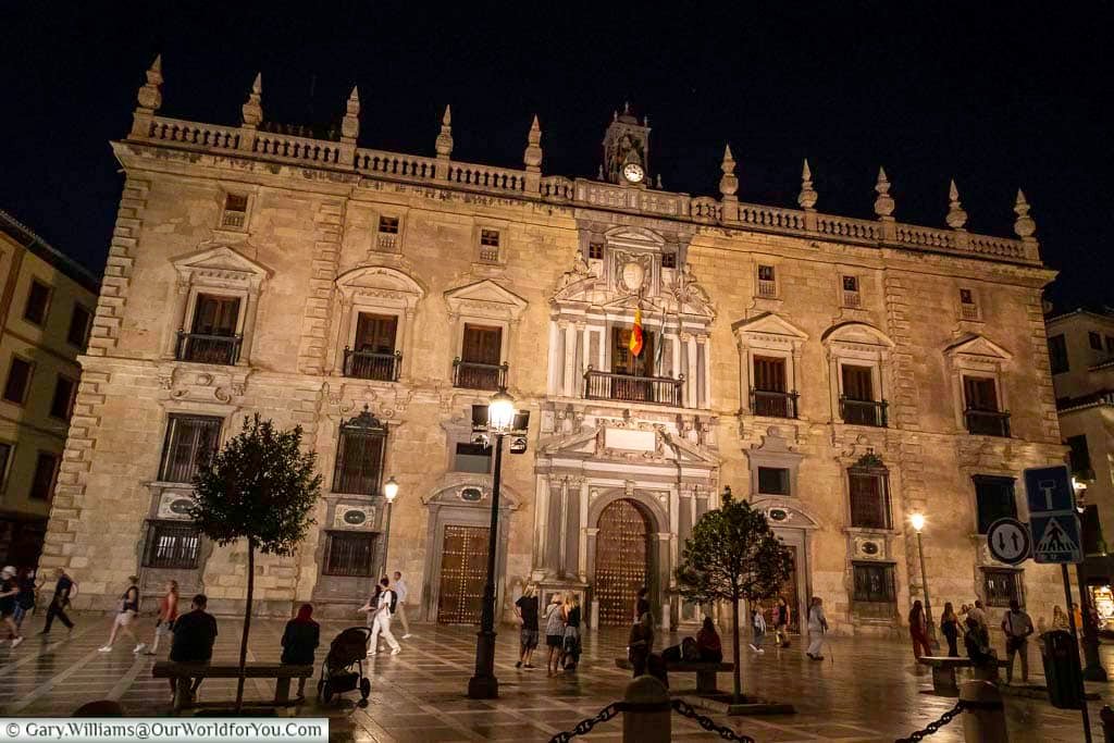 the ornate facade of the superior court of justice of andalusia in granada, spain at night