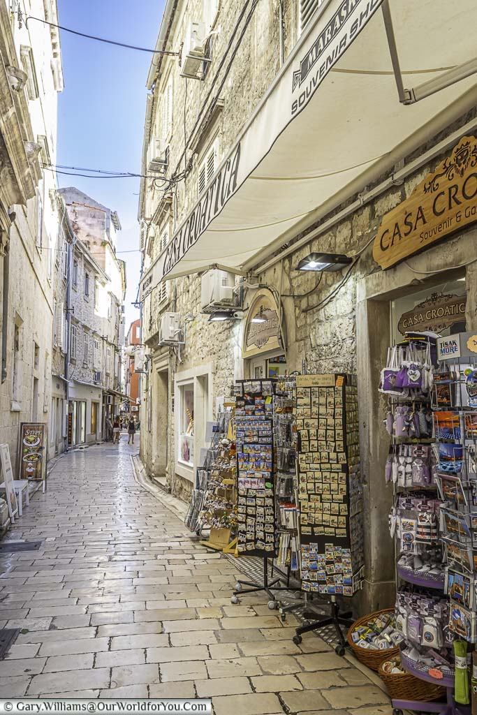 A narrow cobbled lane, lined with shops selling tourist wares in old town zadar, croatia