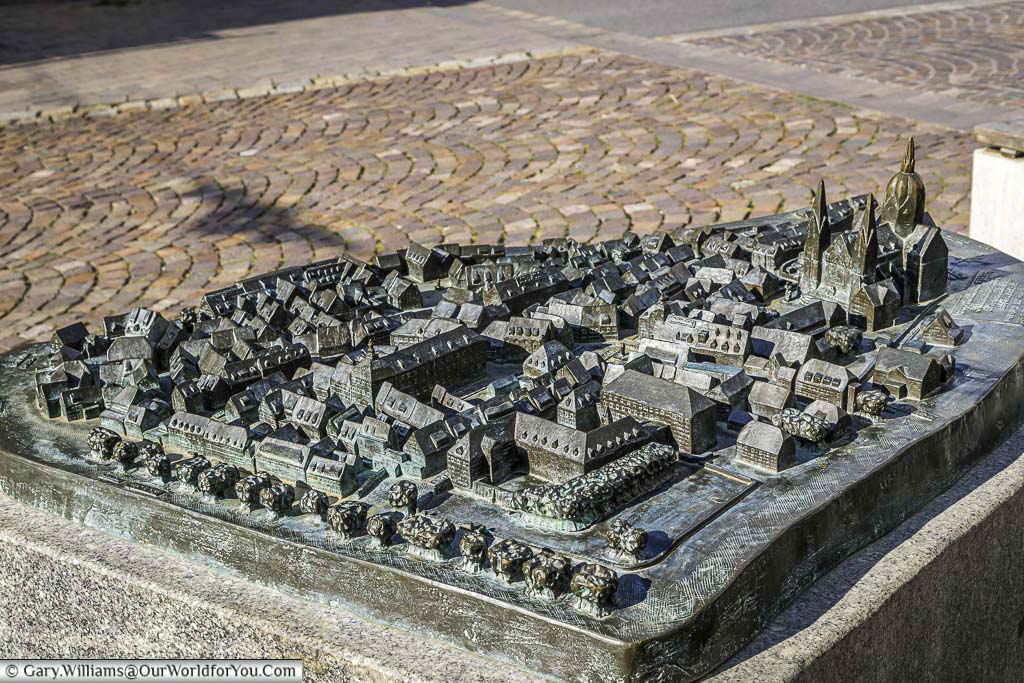 A tactile brass 3D map of the Old Town of Heppenheim with the cathedral dominating the town