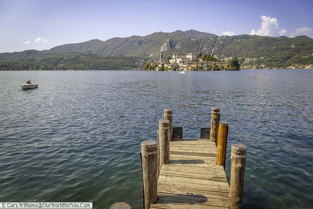 The view from the lakeside to the small island of Isola San Giulio on Lake Orta