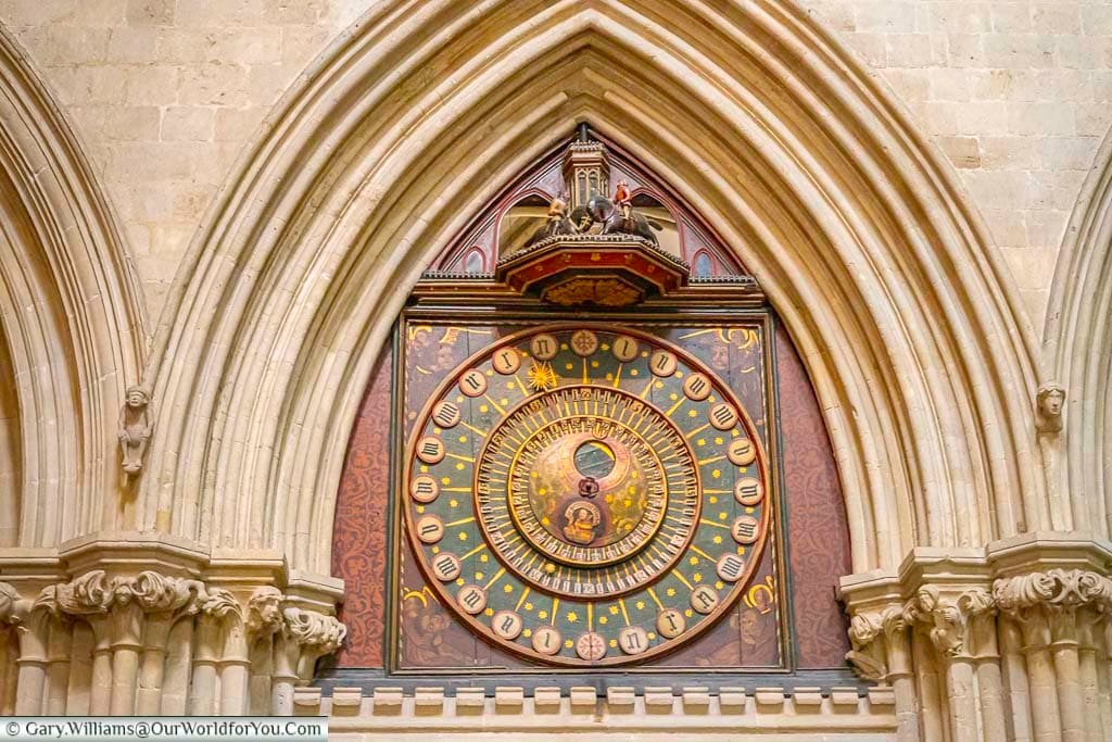 a close-up of the astronomical clock in wells cathedral, somerset