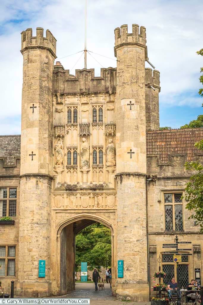 The stone tower with a gateway at its base leading to the archbishop's palace at the top of wells market place in somerset