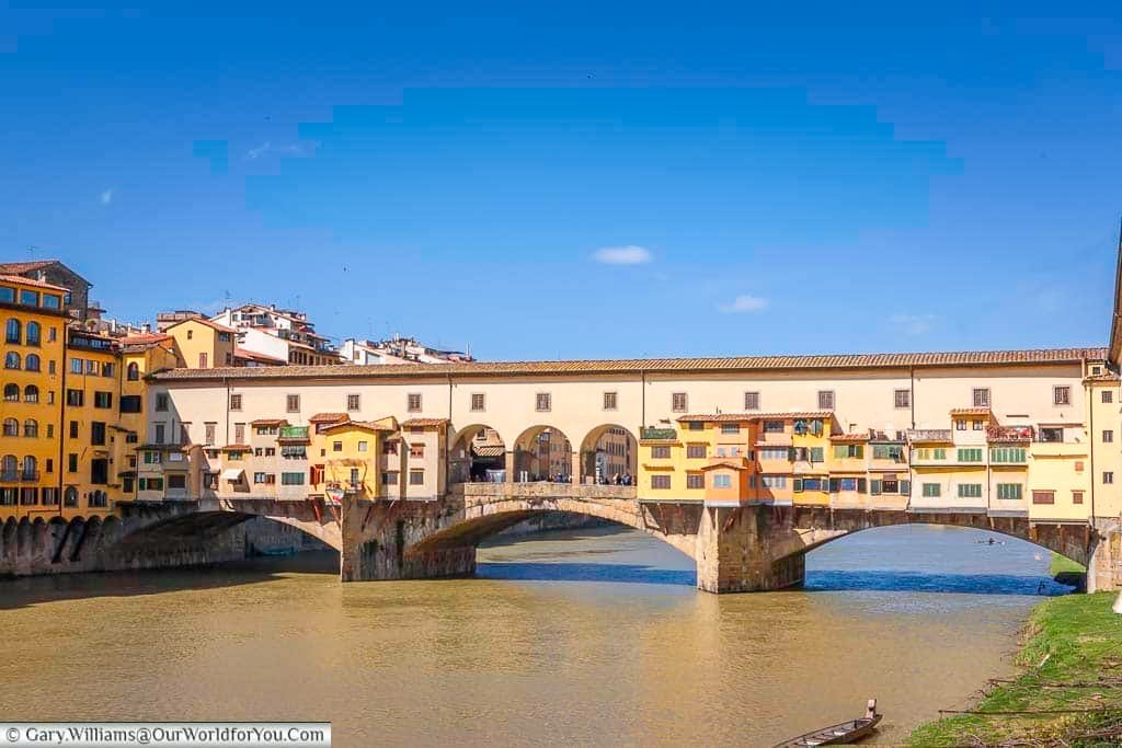 a view of the ponte vecchio, as seen from the river banks of the arno in florence, tuscany