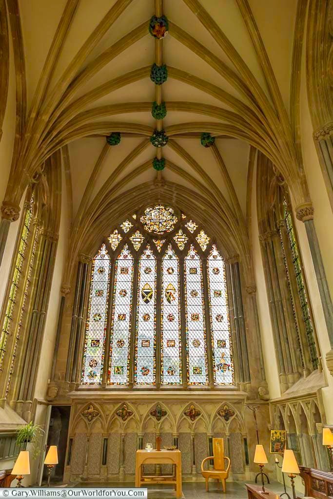 The chapel of archbishop’s palace in wells, somerset, with its vaulted ceiling and stained glass windows