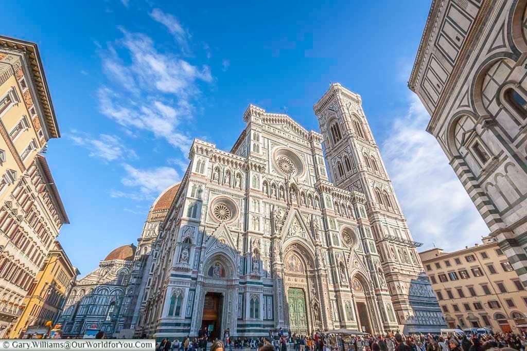 The crowds in front of the ornate Duomo in Florence, Italy