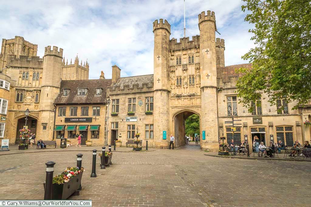 The top of well's market place with the entrance to the archbishops palalce, the paupers gate and a glimpse of wells cathedral