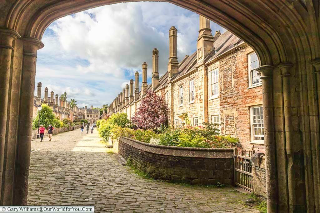 The view through the stone archways to the two rows of 15th-century houses that make up vicar's close in wells somerset