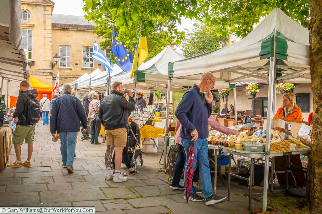 the bustling wednesday market in wells market place in front of wells town hall