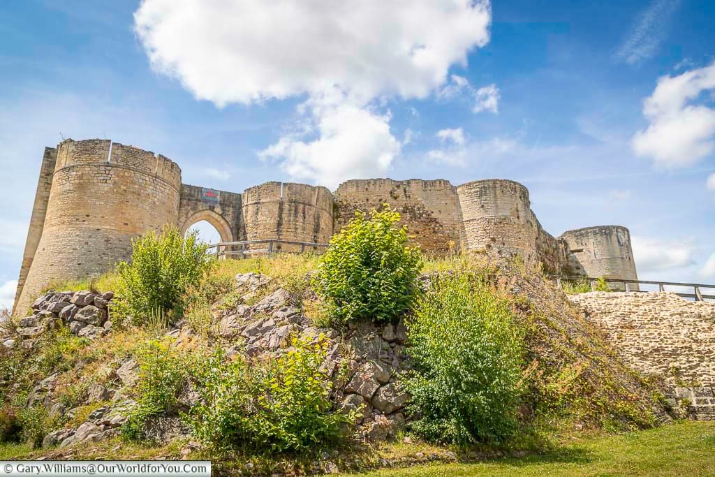 Looking up from street level to the early medieval falaise castle built on a rocky outcrop