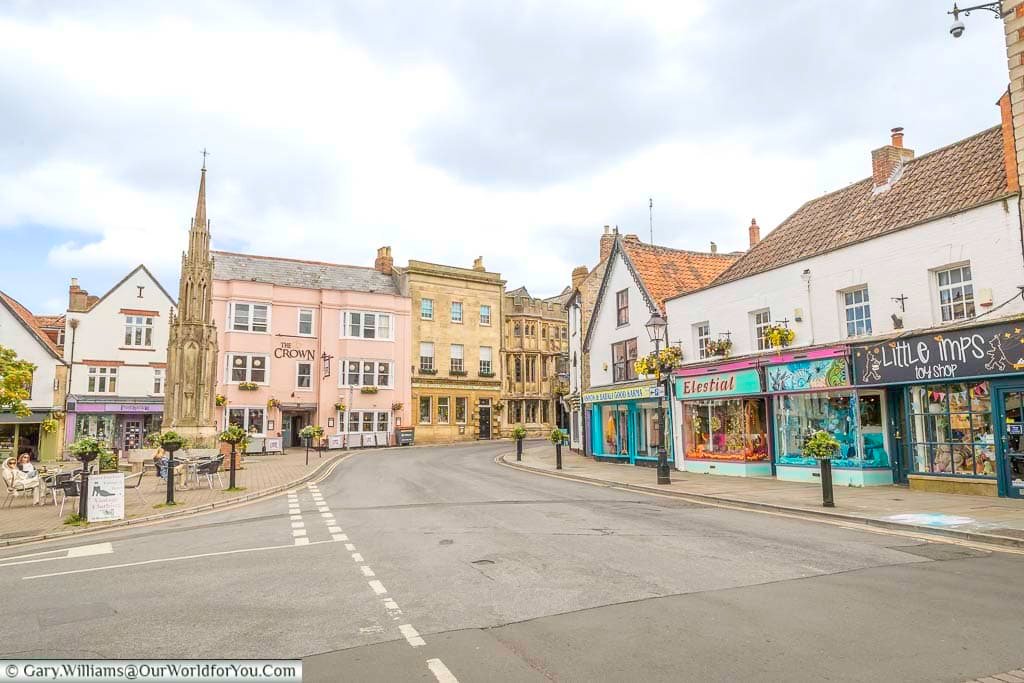 The view along the colourful magdalene street to the crown inn on market place in glastonbury sumerset