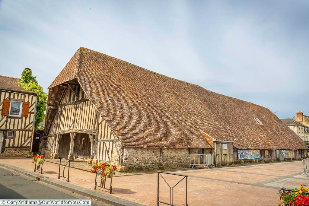 the historic enclosed medieval market hall with its steep pitched tiled roof measuring about 50 by 10 metres in the heart of dives-sur-mer in normandy