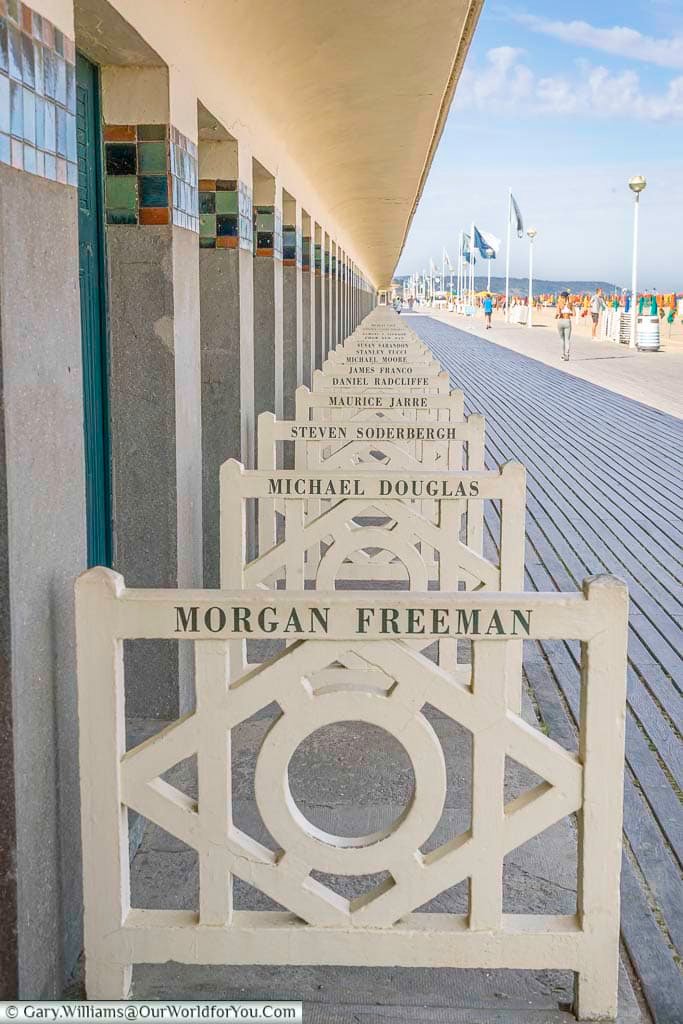 A row of beach hut markers to famous individuals from hollywood on the promenade de planches in deauville, normandy, france