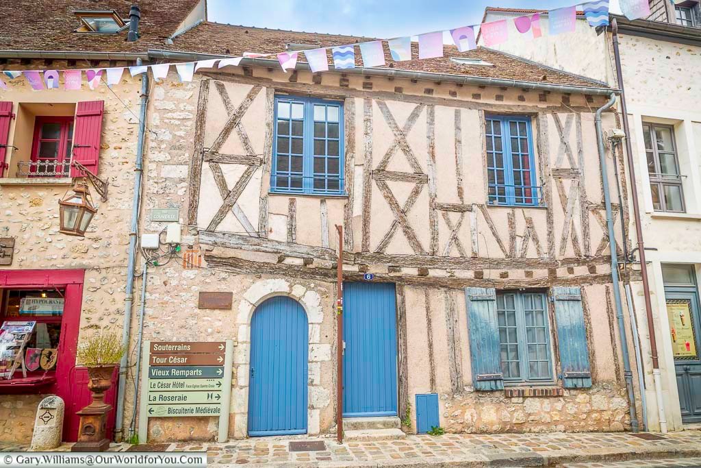 A half-timbered building in the heart of old historic provins in the ile de France region of France, the first stop on our French EV road trip.