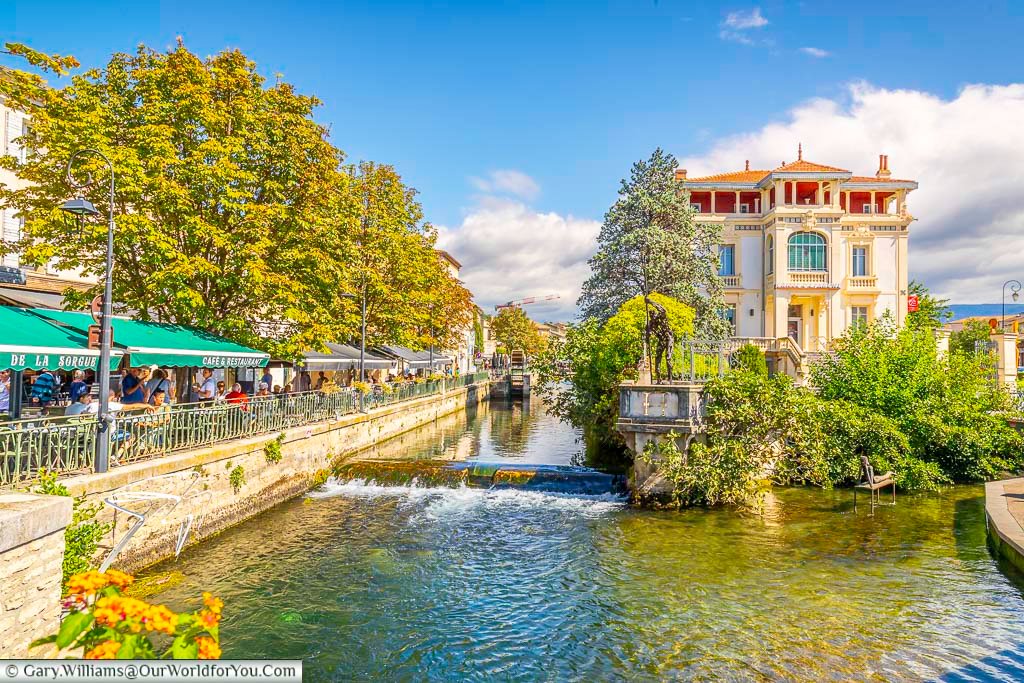 Restaurants linning the edge of the river sourge in the provence town of the l'isle-sur-la-sorgue in southern france