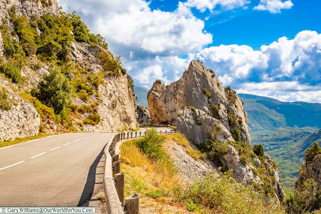 A striking d-road carved between the rocks in the alpes-de-haute-provence region of france