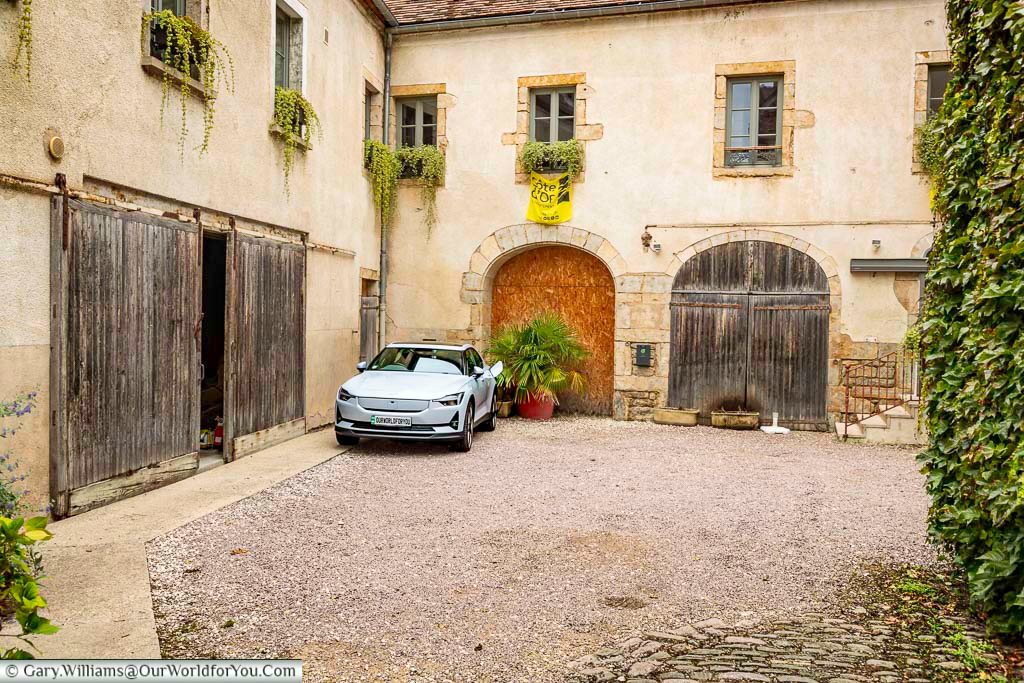 Our polestar 2 charging in the courtyard of the hotel relais de la cote d'or in the cote d'or region of france