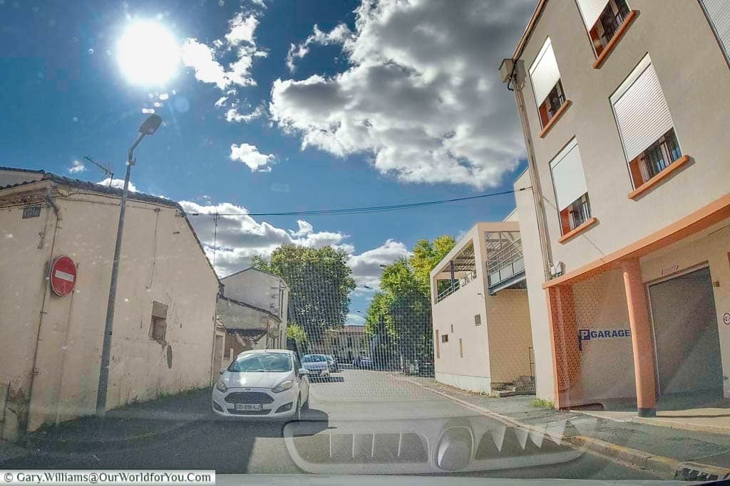 A dashcam screenshot of the restricted entrance to our hotel garage in bergerac in the bordeaux region of france