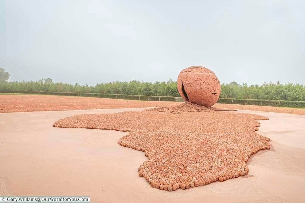 The the miniature clay soldiers spilling out of a giant egg at the coming world remember me exhibition in belgium