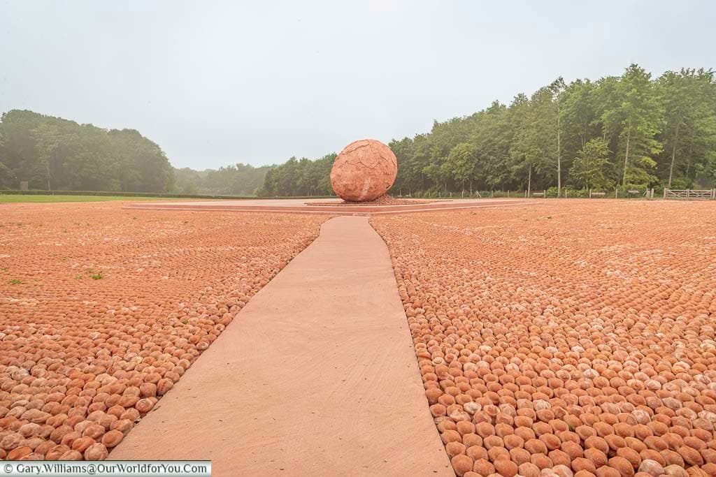 A path between the thousands of the miniature clay soldiers spilling out of a giant egg at the coming world remember me exhibition in belgium