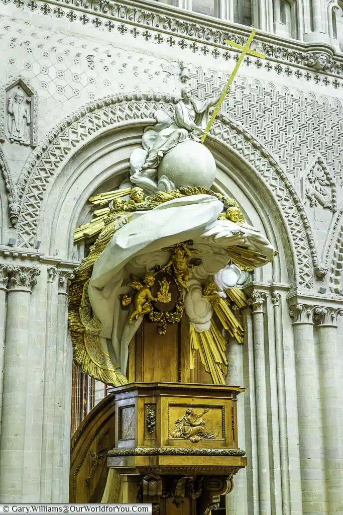 The intricate wood carved and gold embellished pulpit inside bayeux cathedral in normandy, france