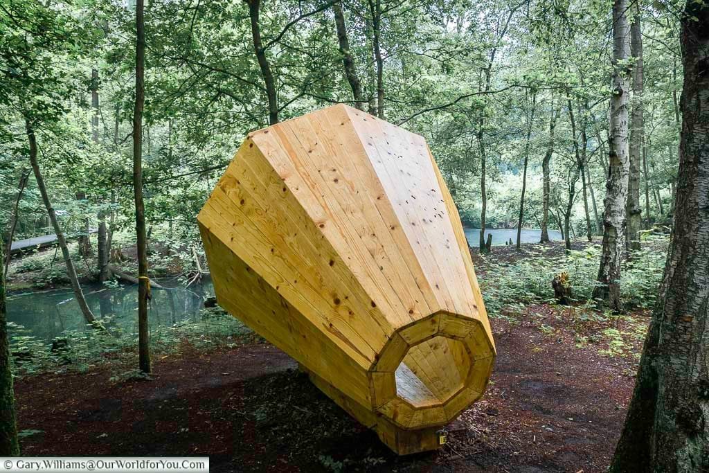 A giant cone shaped wooden speaker next to a pond in the woodland around the bluff in the ypres salient