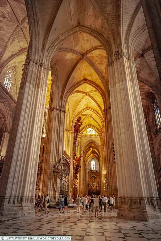 A floor to ceiling view of the inside of Seville Cathedral.