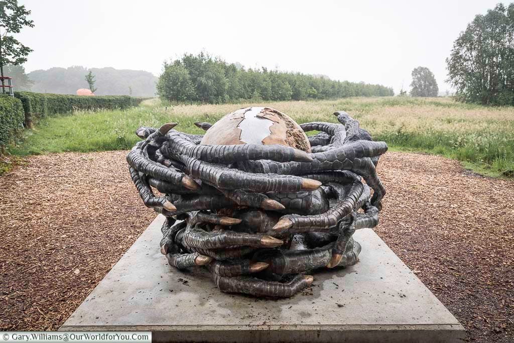 The remember me installation at the CWXRM exhibition of a bronze cracked egg, wrapped in claws