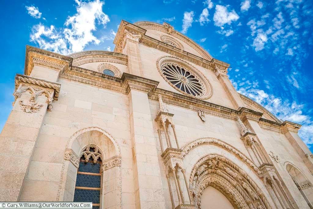 Looking up at the ornate facade of the Cathedral of St James in Šibenik.