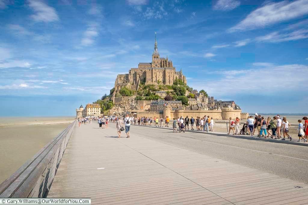 A shot of the wide, paved, causeway to the island of Mont-Saint-Michel , Normandy