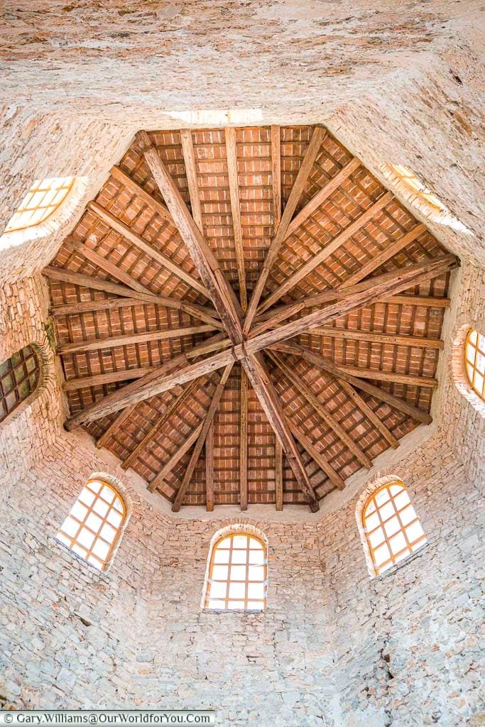 Looking up inside the bell tower to the wooden floor of the bell chamber.