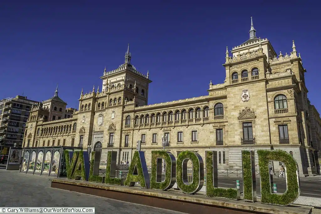 The Valladolid city sign in front of the historic cavalry academy in northern spain