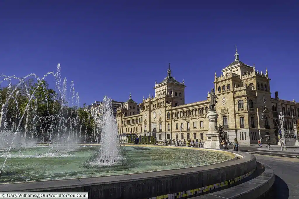 A large fountain in front of the renaissance styled cavalry academy in valladolid in the castile and león region of spain
