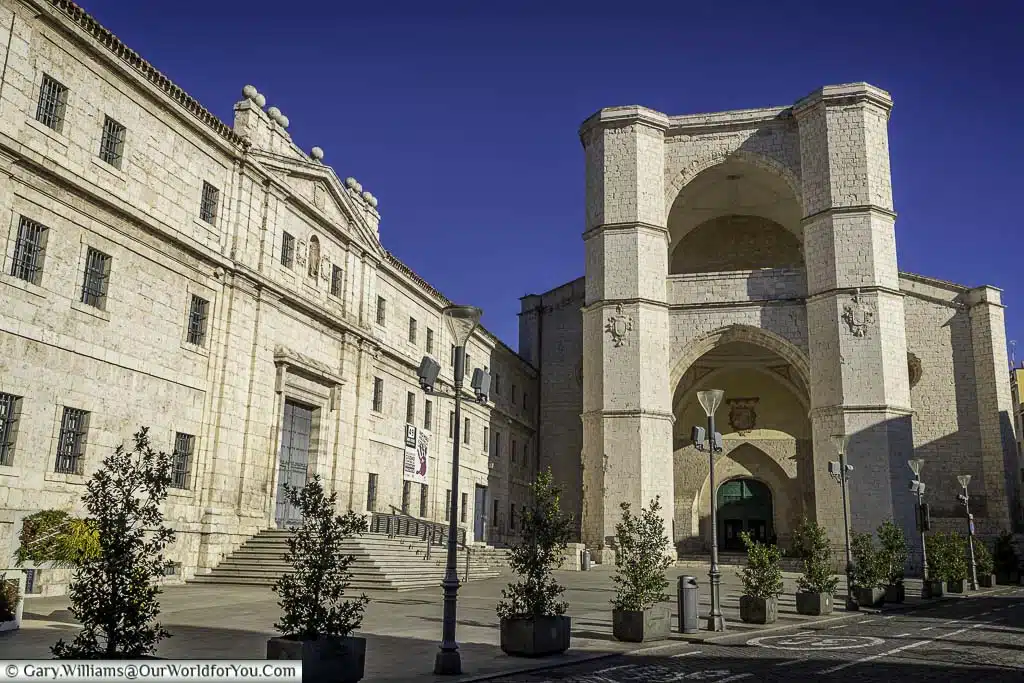 The plaza in front of the grand stone entrance to the iglesia se san benito (church) in central valladolid in the castile and león of spain
