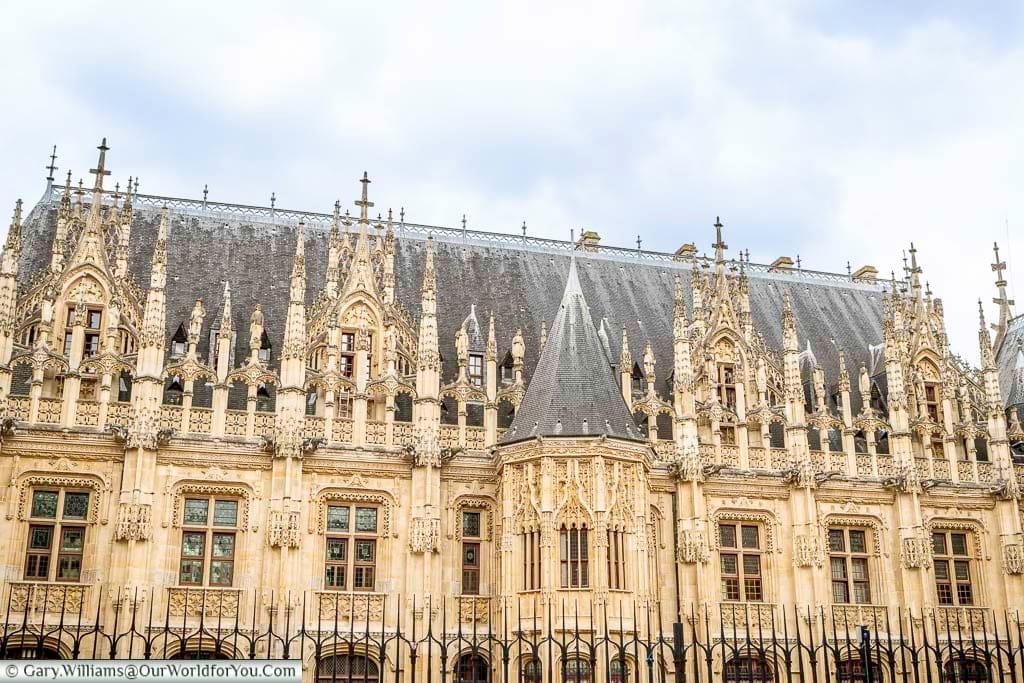 The beautiful gothic detail in the Palais de Justice in the centre of Rouen. The golden stone still seems bright under grey skies.