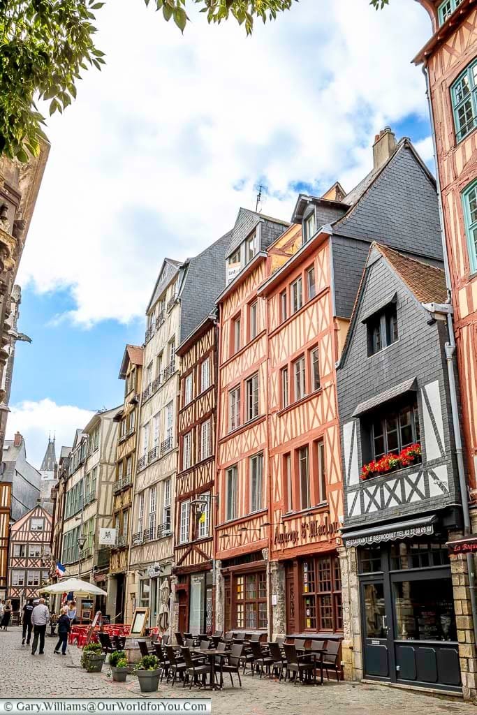tables and chairs outside half-timbered building in the historic heart of old rouen, normandy
