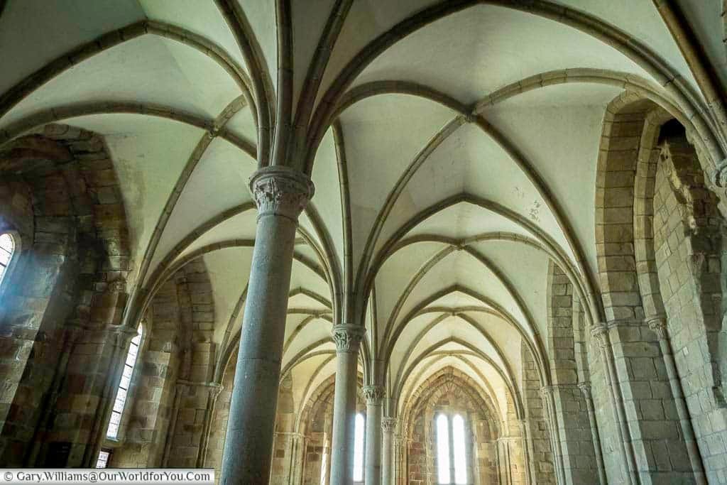Inside the Great Hall, with its high vaulted ceiling, of Mont-Saint-Michel Abbey.