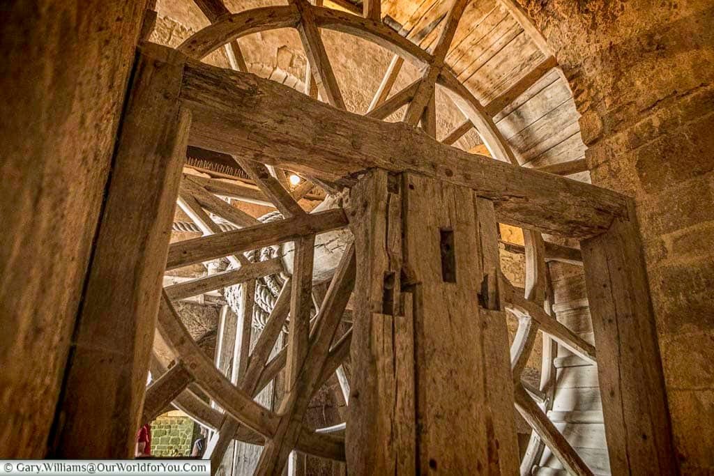 The giant, wooden, wheel, used for lifting goods from the lower levels of Mont-Saint-Michel Abbey.