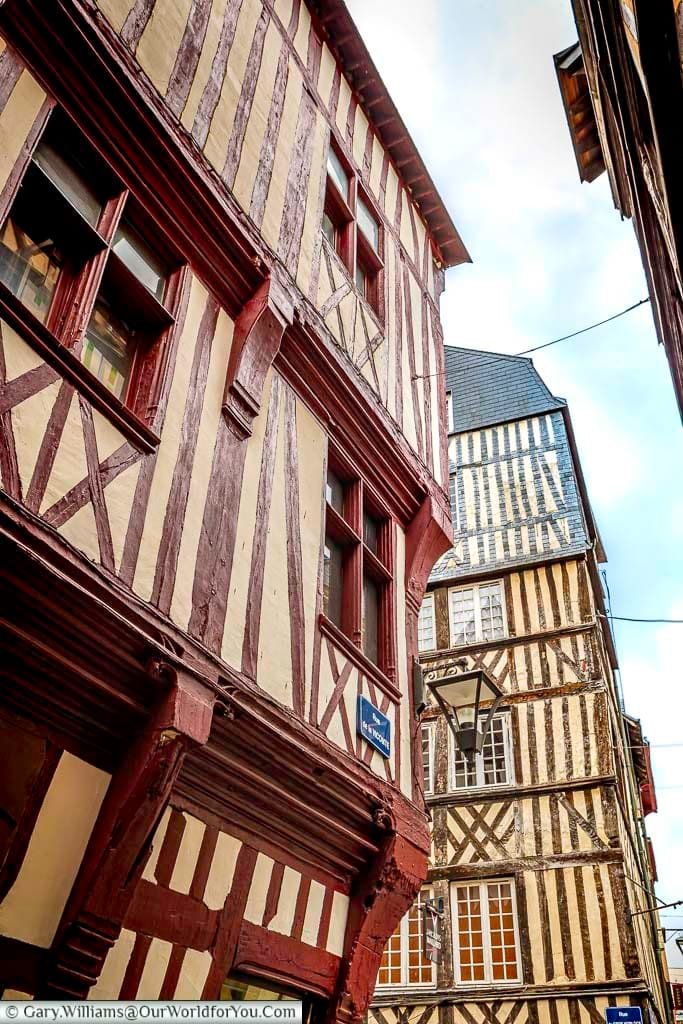 A close-up look of two of the traditional buildings in the centre of Rouen featuring half-timbered constructions that is so typical of the Normandy region of France
