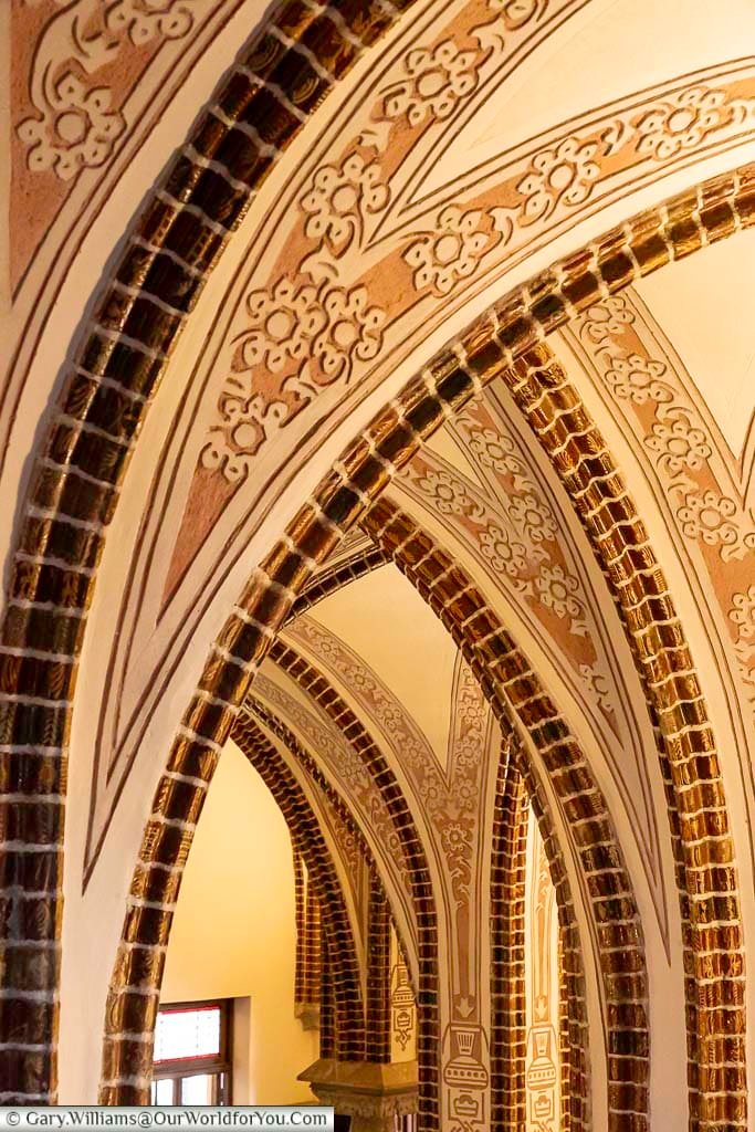 A close-up view of the vaulted arches inside the episcopal palace of astorga in northern spain