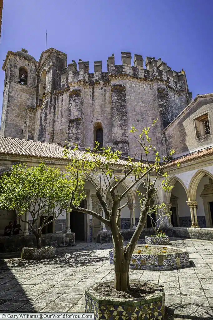 small trees in the courtyard of the cemetery cloister in the convent of christ in tomar, portugal