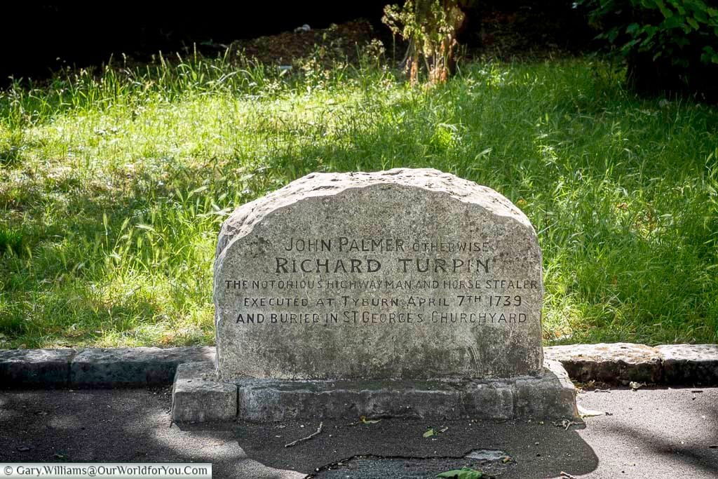 The gravestone of the notorious highwayman Dick Turpin in St George’s Churchyard, York. This historic site is a unique stop for visitors exploring York’s darker past.