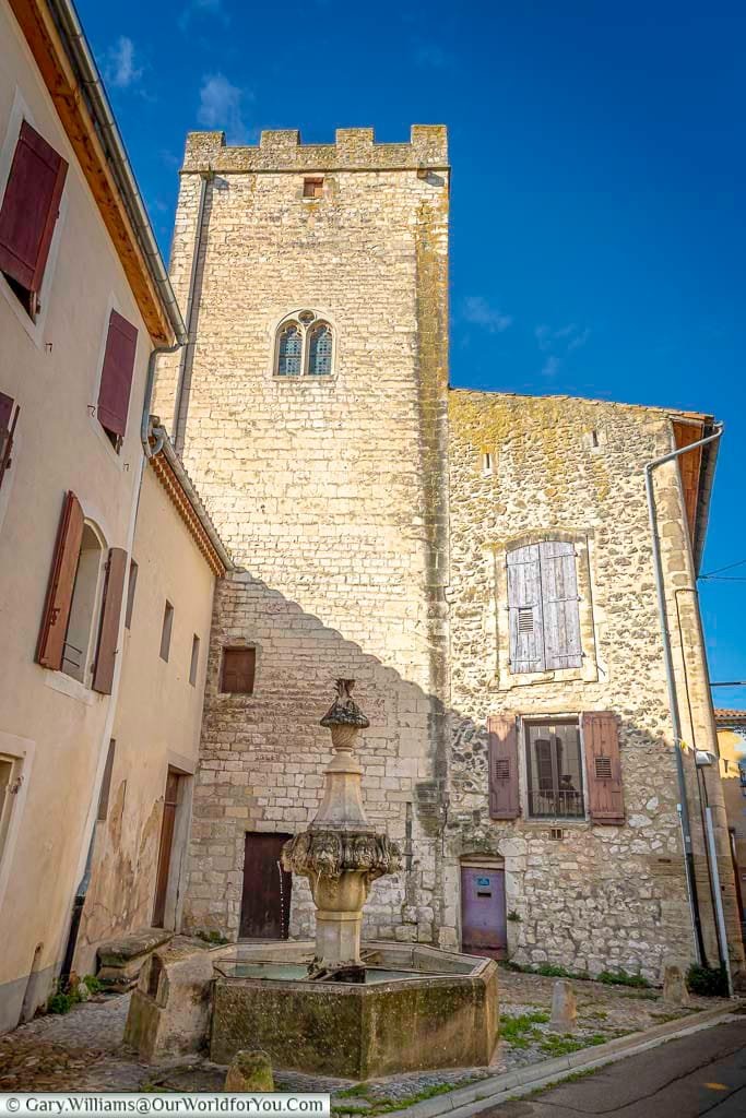 The Gigot Fountain stands beneath a medieval stone tower in the charming village of Pernes-les-Fontaines, Provence, capturing the rustic elegance of historic southern France. Surrounded by narrow cobbled streets and shuttered houses, this tranquil spot is a hidden gem for cultural explorers and photographers alike.