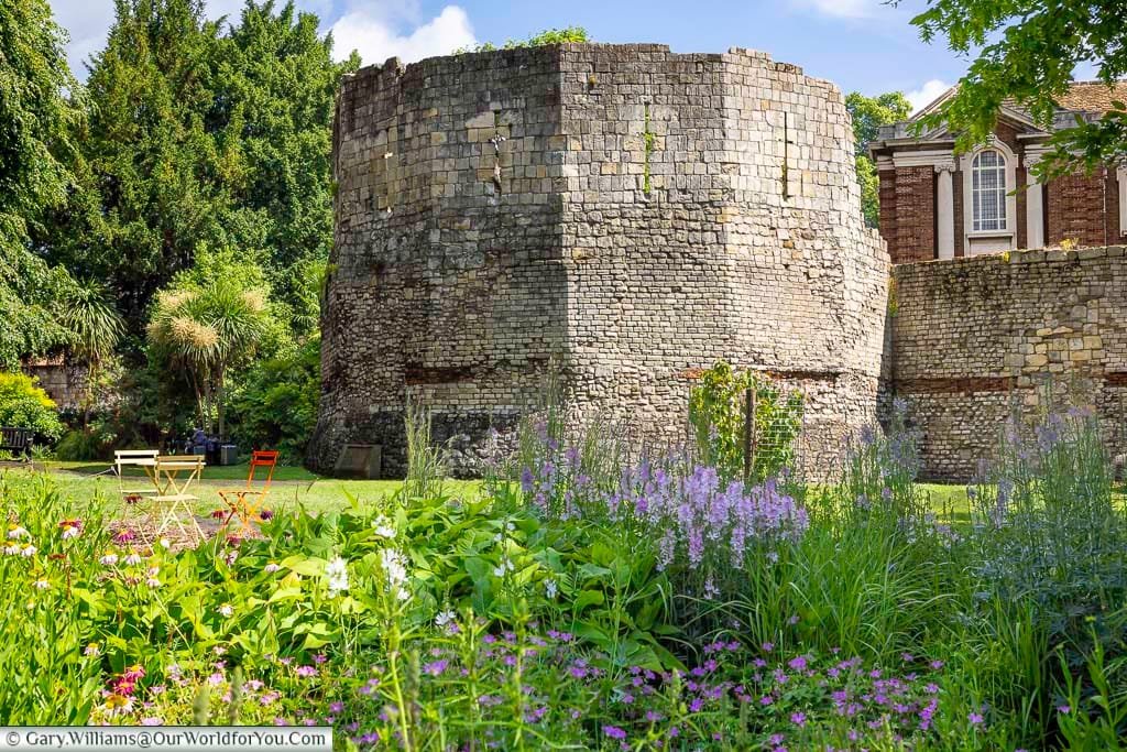 The Multangular Tower in York Museum Gardens, a well-preserved remnant of the city’s Roman fortress. Surrounded by flowers and greenery, it’s one of the top historic landmarks to explore in York.